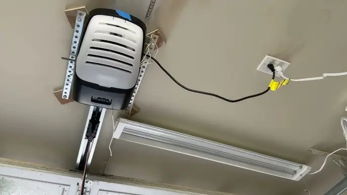Garage door opener plugged in.