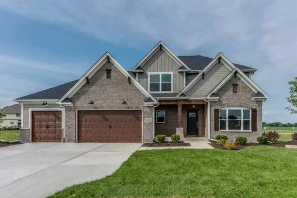 New grass and landscaping complimenting new house