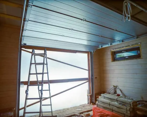 maintenance of steel roller garage door, contra light indoor shot