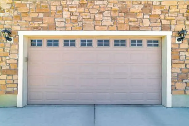 A modern garage door of a beautiful building on a sunny day