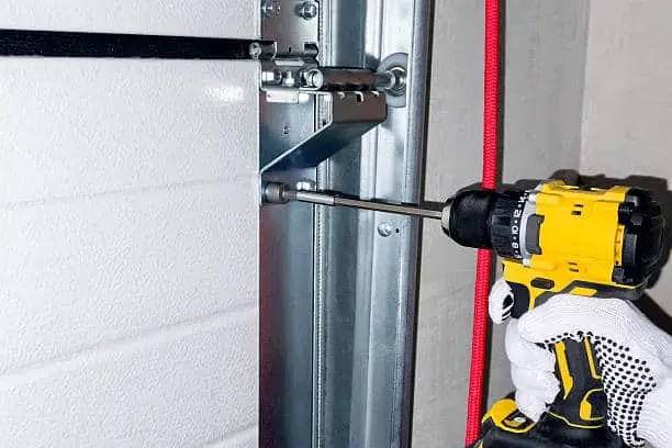 Installation of sectional door rails. The process of fastening rails for sectional doors.