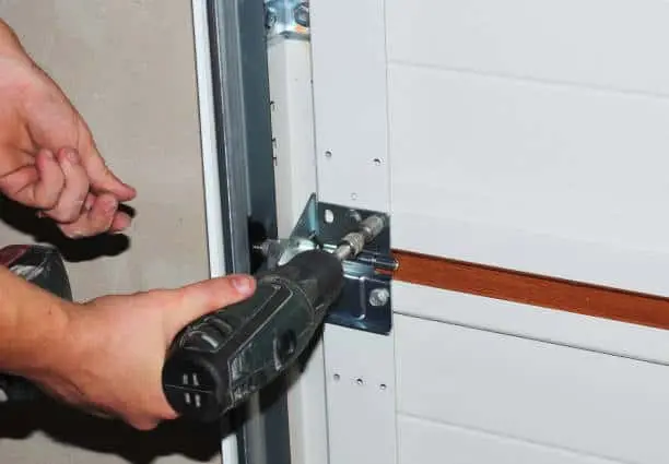 Contractor repair and replace garage door. Howell garage door repair.