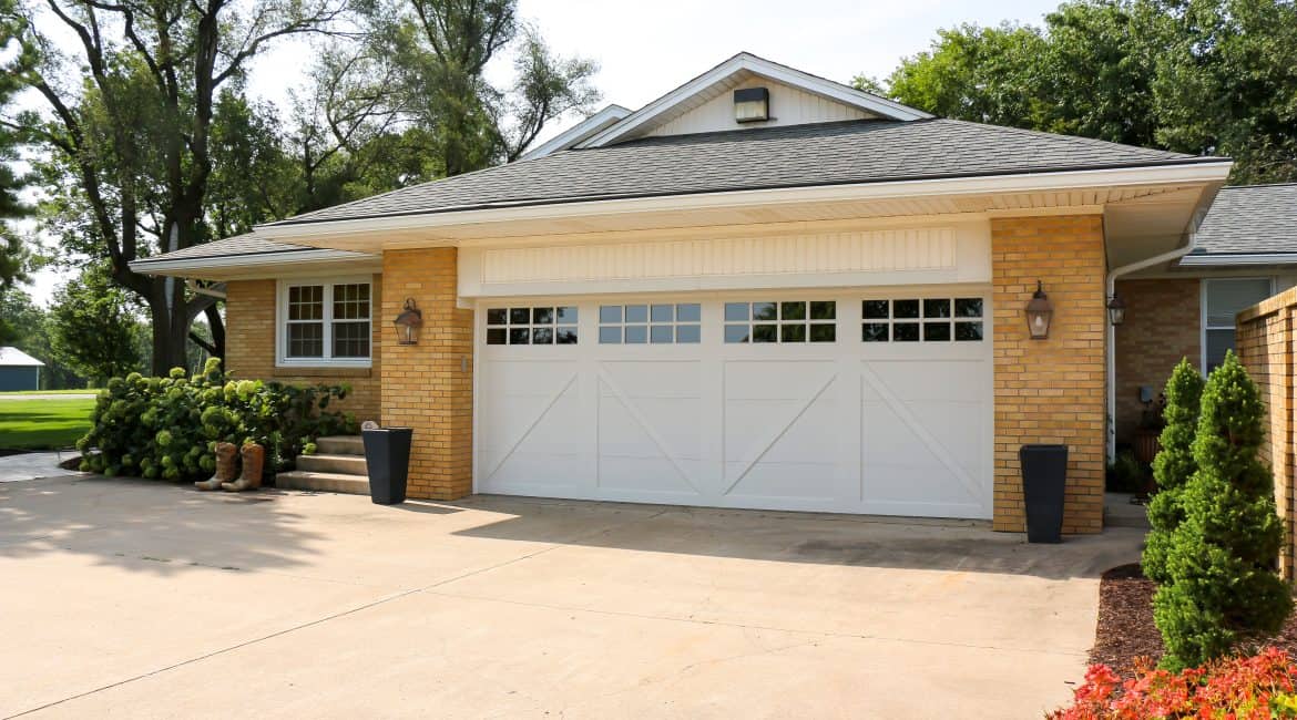 garage door with windows on the front of a house