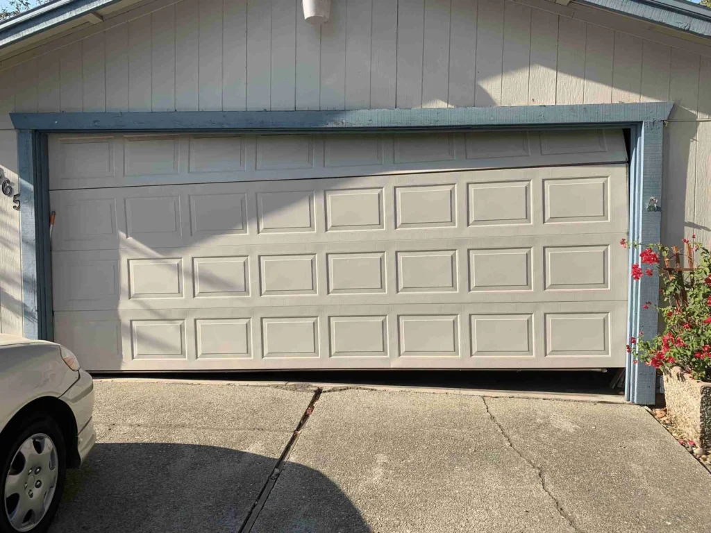 Failed garage door off track in Laingsburg, MI