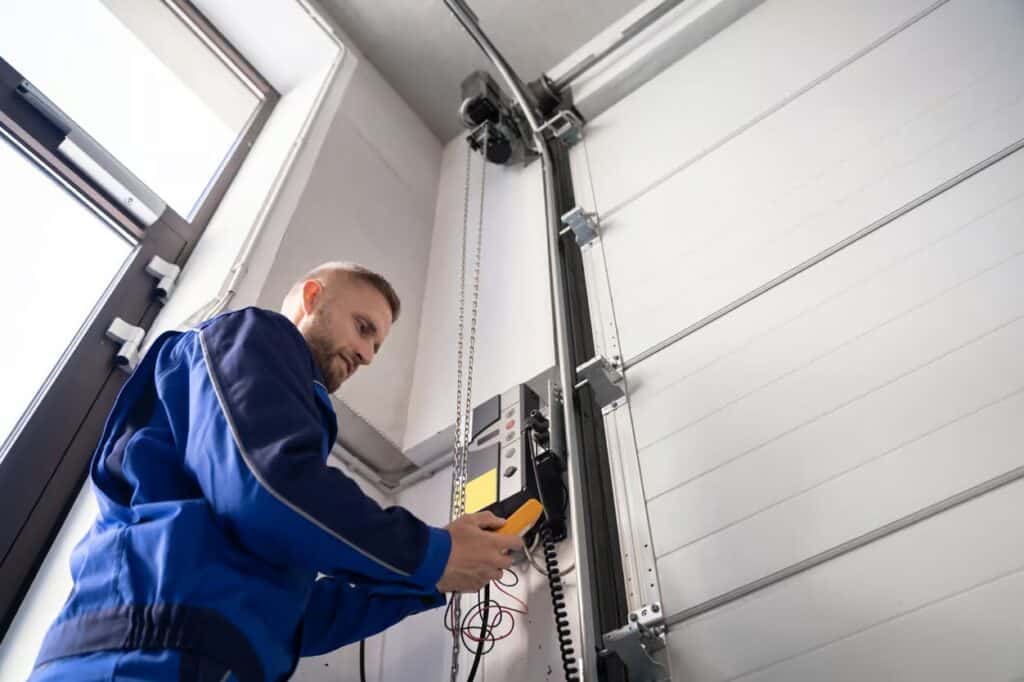 Man fixing garage door