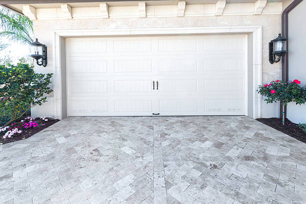 Brand new house with an empty garage. Hell Garage Door Repair.