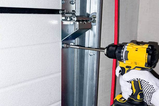 Installation of sectional door rails. The process of fastening rails for sectional doors.