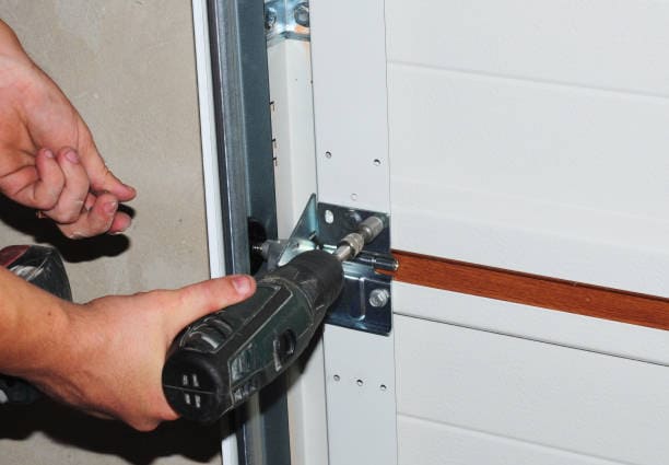 Contractor repair and replace garage door. Garage door installation.
