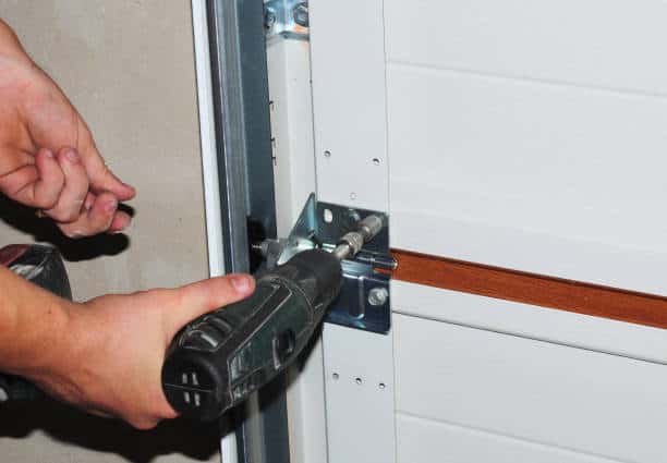 Contractor repair and replace garage door. Howell garage door repair.