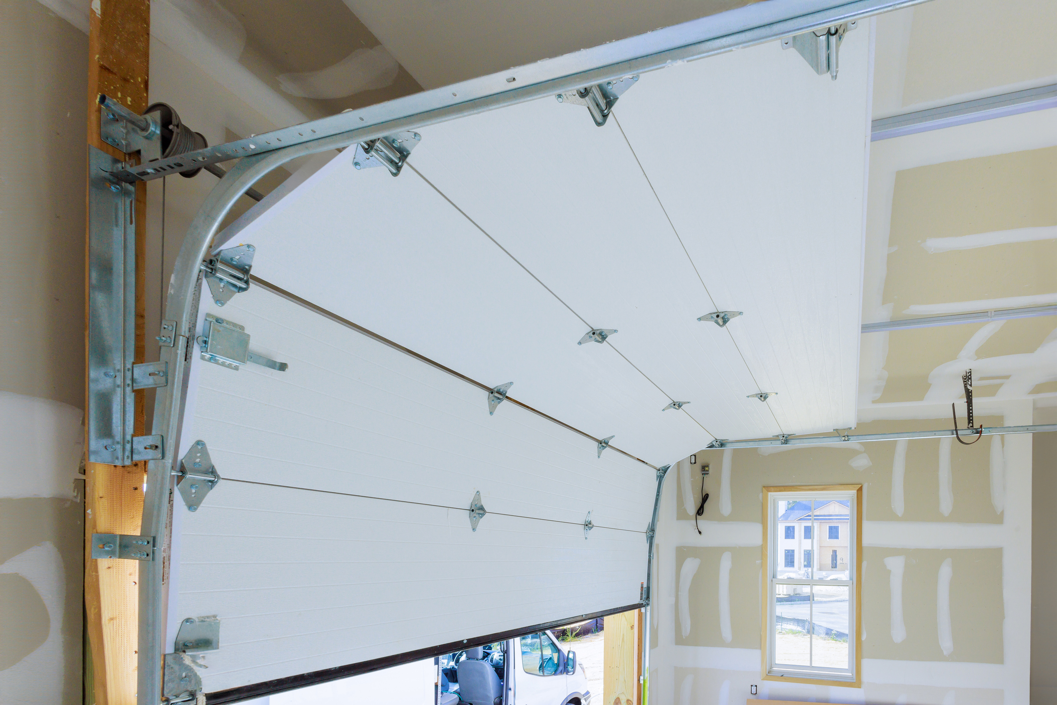 Installation of rolling shutters plastic garage doors in new house