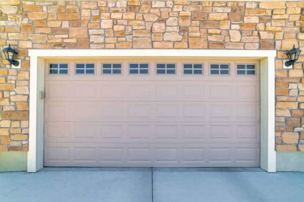 A modern garage door of a beautiful building on a sunny day - North Branch Garage Door Repair