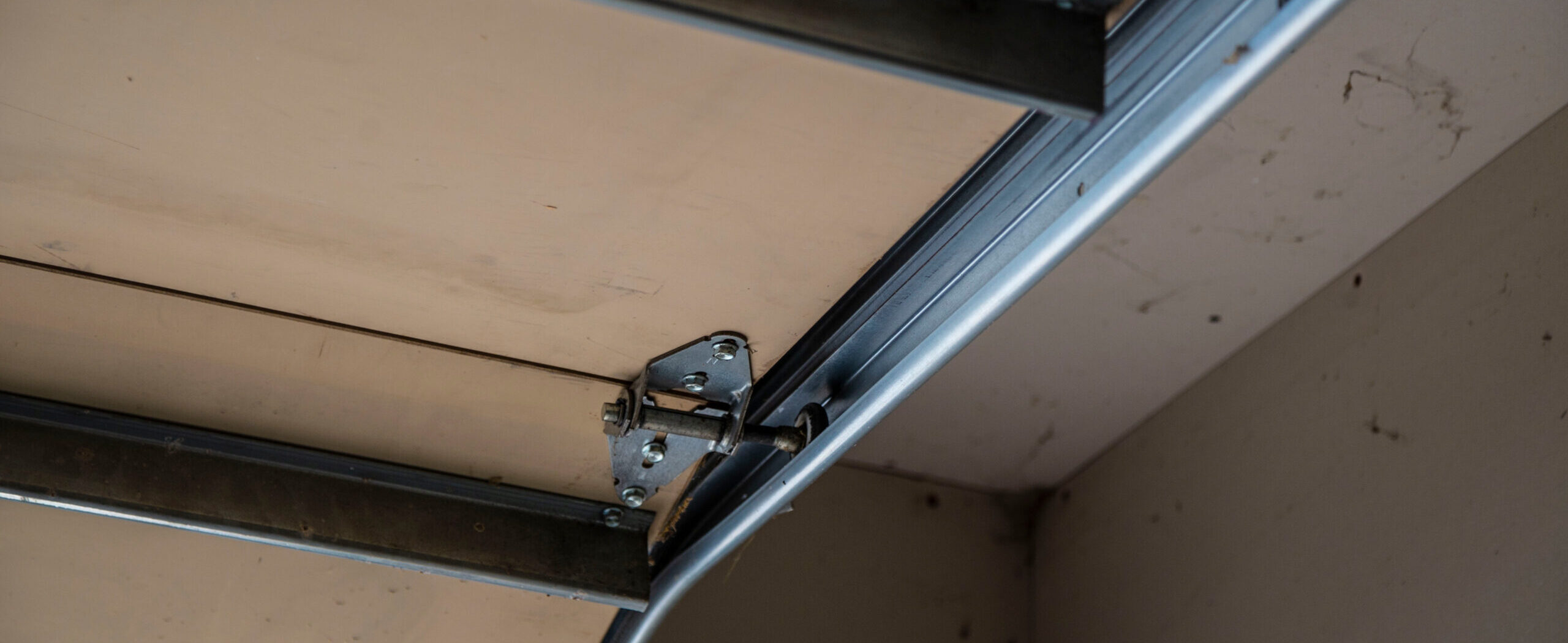 Close up of a garage door track.
