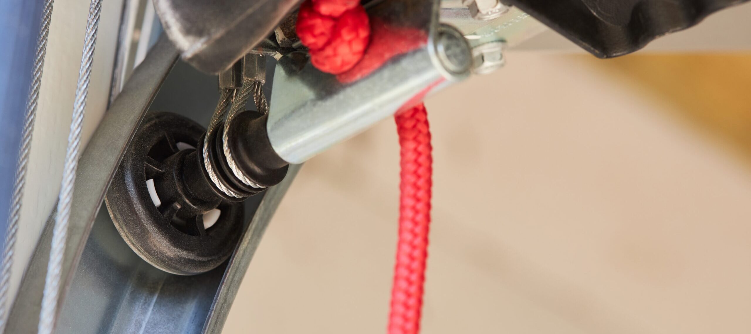 Close up of a garage door wheel.