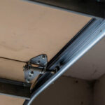 Loose garage door hardware causing noise